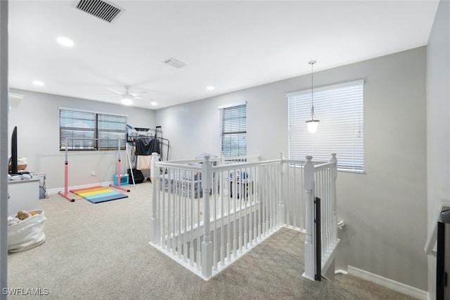 game room featuring a healthy amount of sunlight, carpet flooring, and ceiling fan