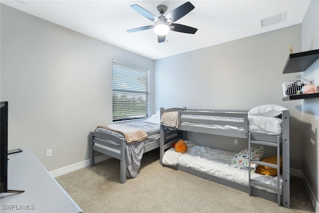 bedroom with ceiling fan and light colored carpet