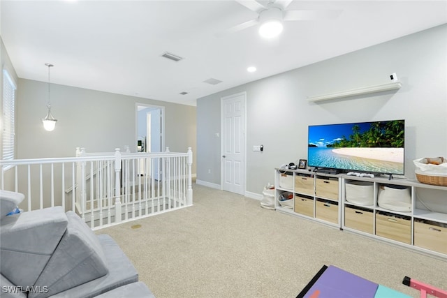 living room featuring carpet flooring and ceiling fan