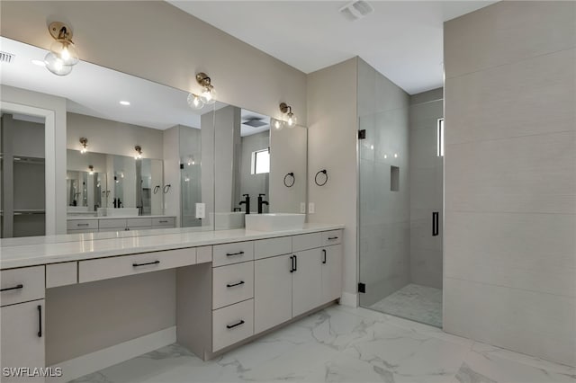 bathroom featuring vanity and an enclosed shower