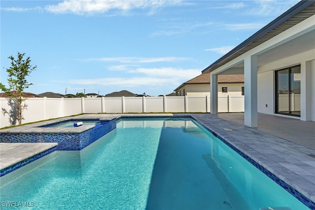 view of pool featuring an in ground hot tub and a patio area