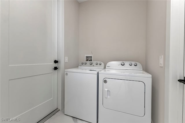 clothes washing area with independent washer and dryer