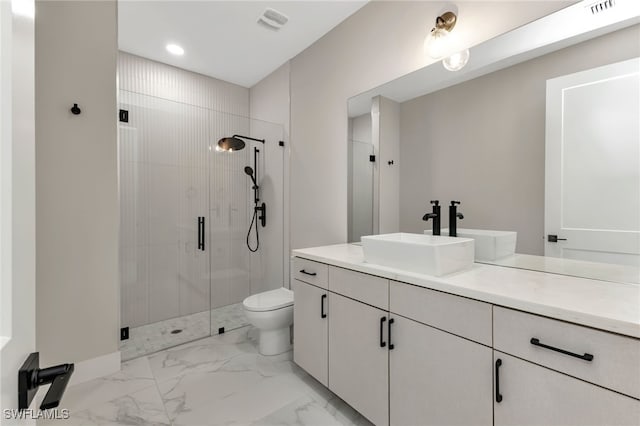 bathroom featuring walk in shower, vanity, and toilet