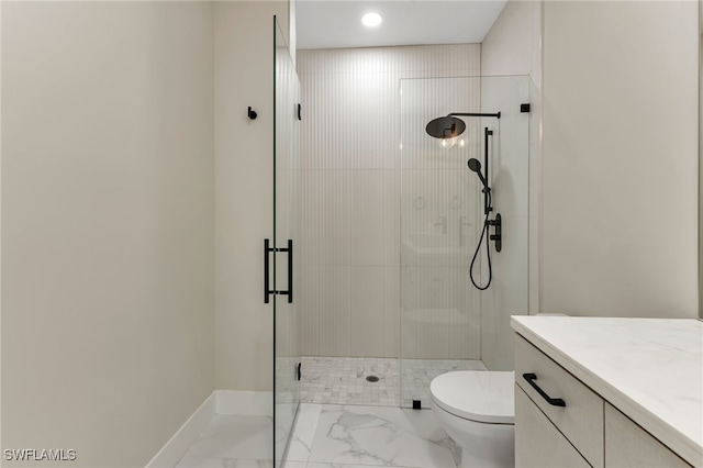 bathroom with vanity, toilet, and an enclosed shower