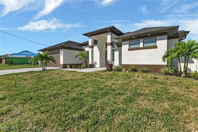 prairie-style house featuring a front yard