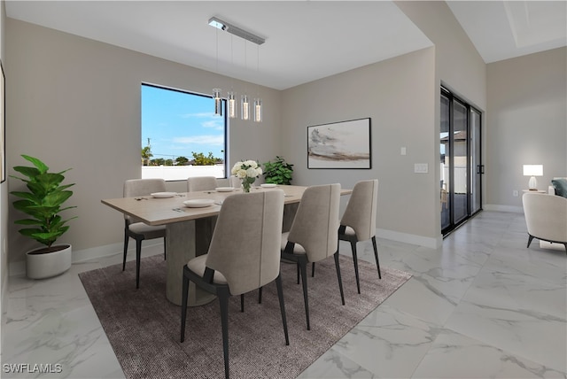 dining space with a chandelier