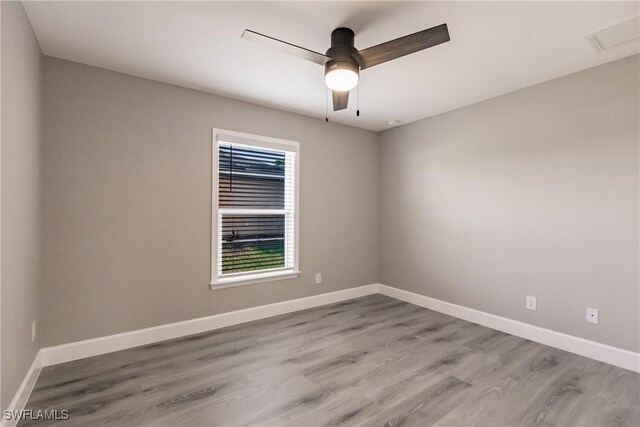 unfurnished room with light wood-style flooring, baseboards, and ceiling fan