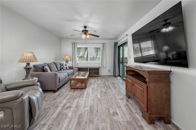 living room with ceiling fan and light hardwood / wood-style floors