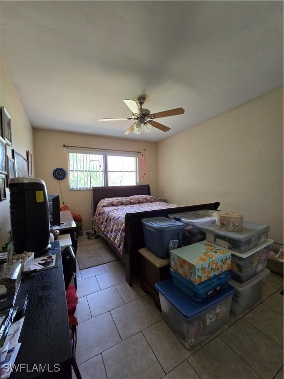 tiled bedroom with ceiling fan