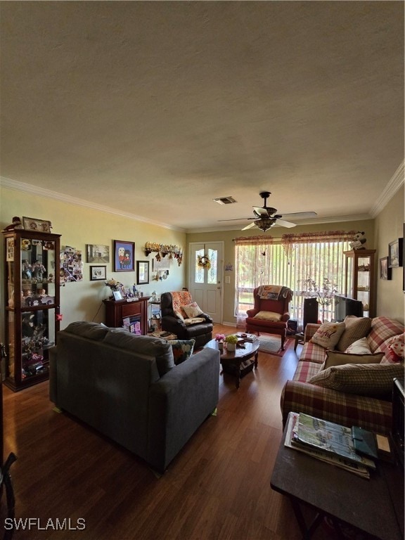 living room featuring crown molding, dark hardwood / wood-style floors, and ceiling fan