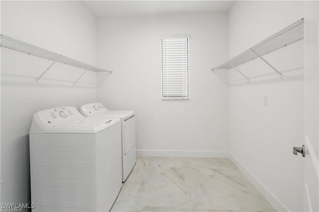 laundry area with washing machine and dryer