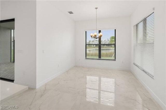 unfurnished dining area with an inviting chandelier