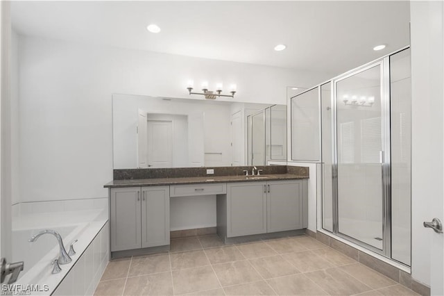 bathroom featuring tile patterned flooring, vanity, and independent shower and bath