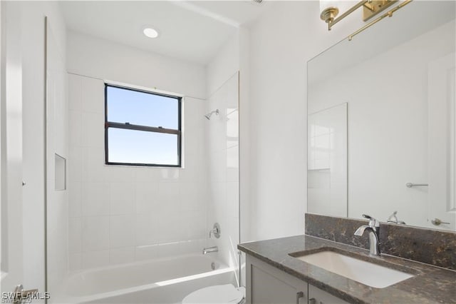 full bathroom with vanity, toilet, and tiled shower / bath