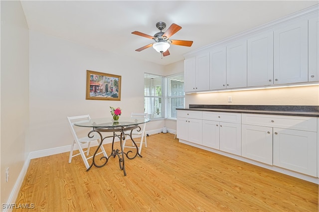 kitchen with ceiling fan, light hardwood / wood-style flooring, and white cabinets