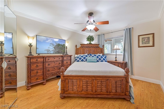 bedroom featuring ceiling fan, light hardwood / wood-style floors, and ornamental molding