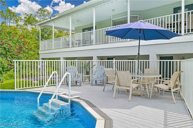 view of pool with a wooden deck