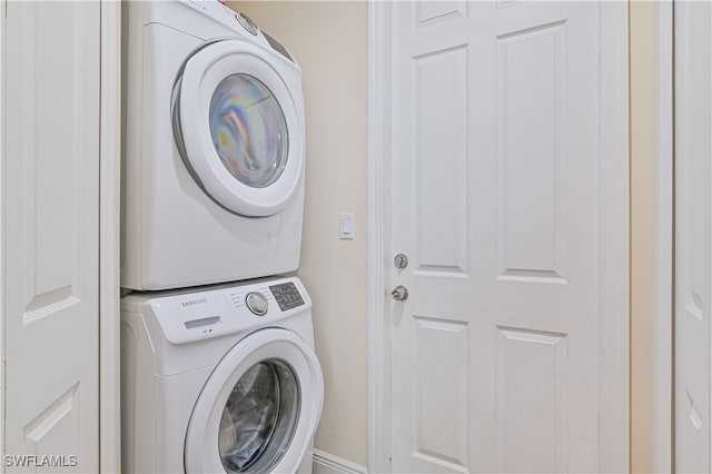 laundry room featuring stacked washer and dryer