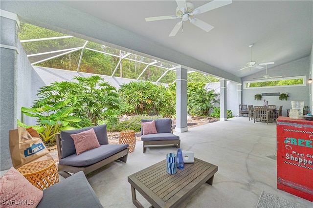 view of patio with an outdoor hangout area, glass enclosure, and ceiling fan