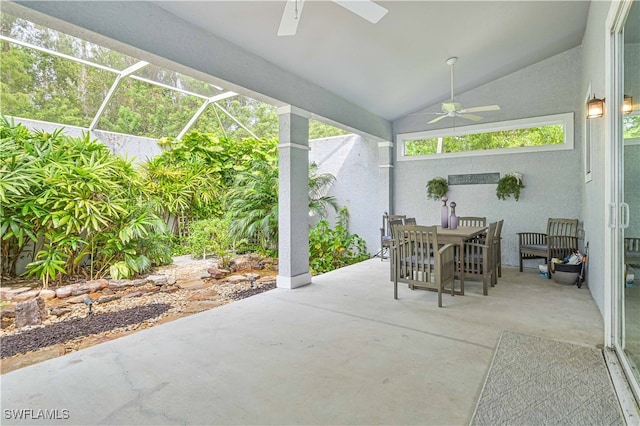 sunroom / solarium with ceiling fan and lofted ceiling