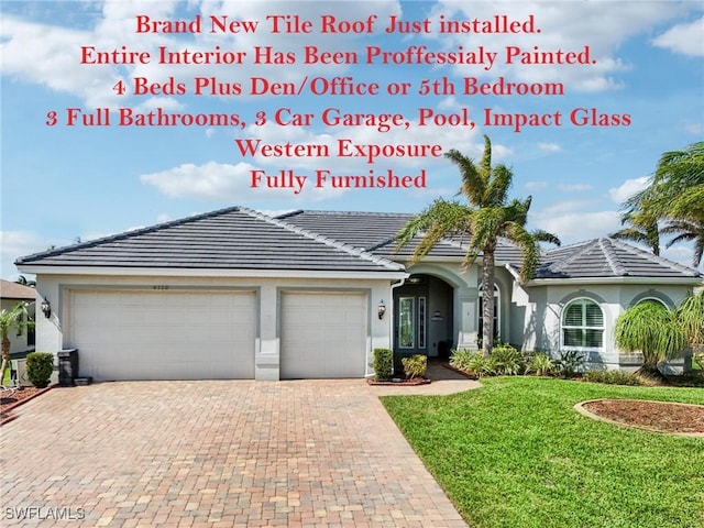 view of front facade with a front yard and a garage