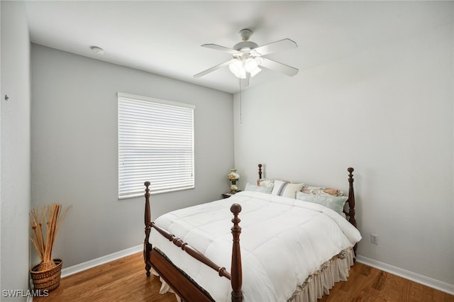 bedroom featuring hardwood / wood-style flooring and ceiling fan