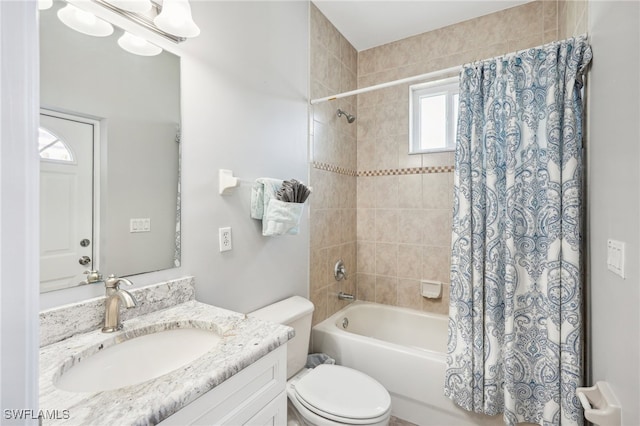 full bathroom featuring shower / tub combo, vanity, and toilet