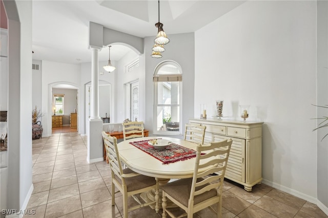 tiled dining space with decorative columns