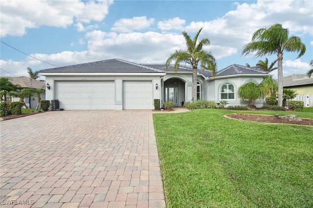 view of front facade with a garage and a front yard