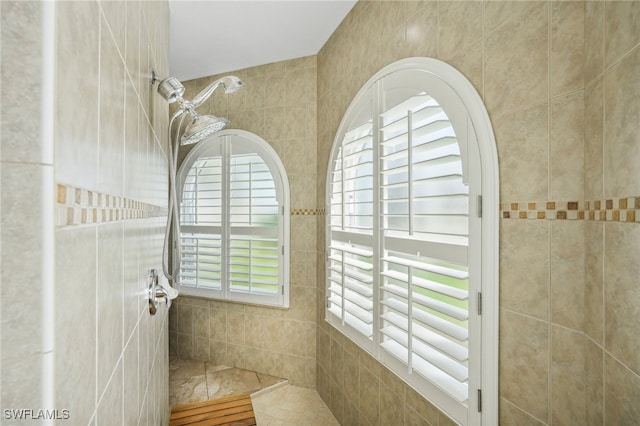 bathroom featuring a shower and tile patterned flooring