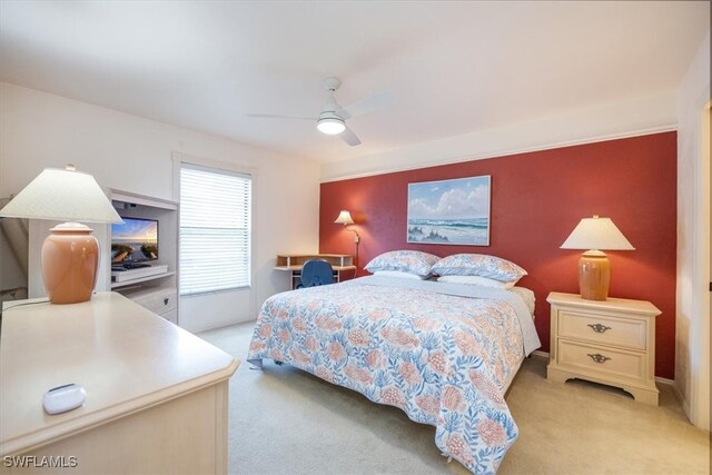 bedroom featuring ceiling fan and light colored carpet