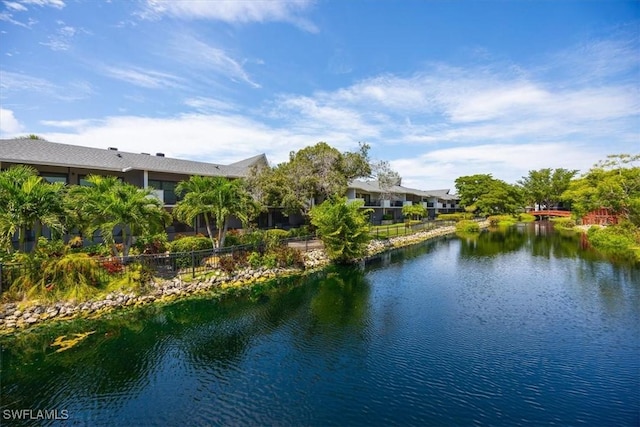 600 Neapolitan Way Unit 115, Naples, FL 34103 - view of water feature with fence