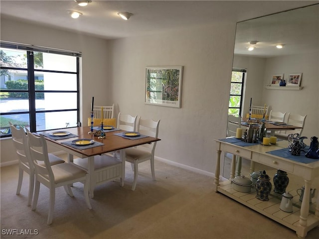 view of carpeted dining area