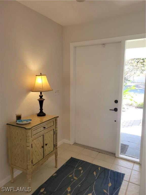 foyer featuring light tile patterned floors