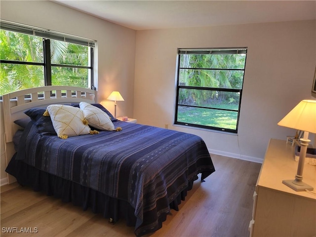 bedroom with wood-type flooring