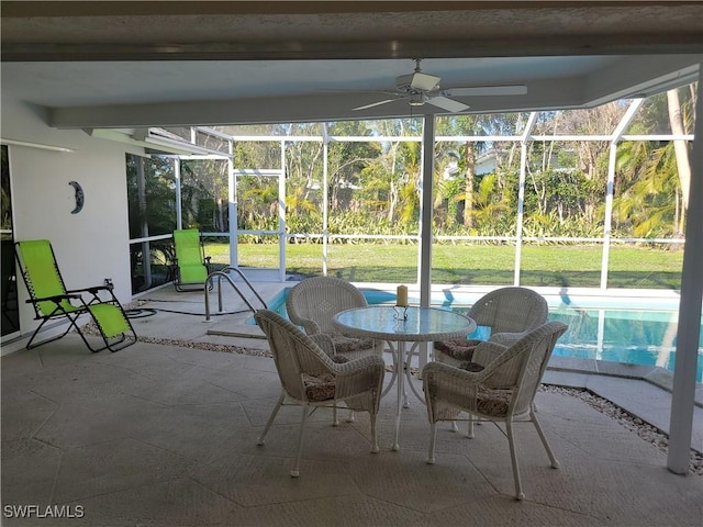 unfurnished sunroom with ceiling fan and a healthy amount of sunlight