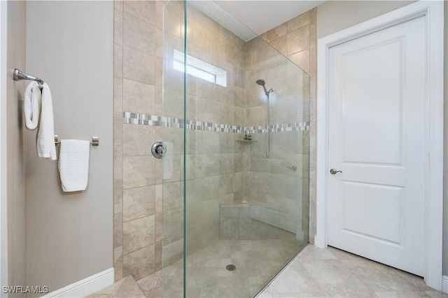 bathroom with a tile shower