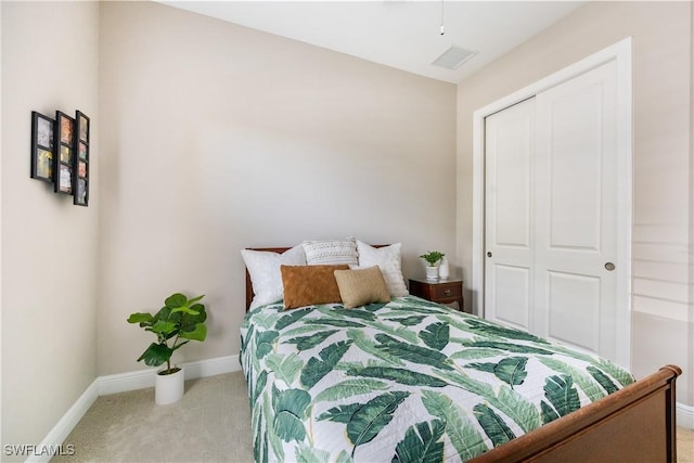 carpeted bedroom with a closet