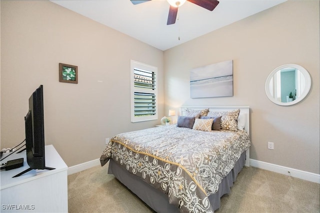 bedroom featuring ceiling fan and light colored carpet