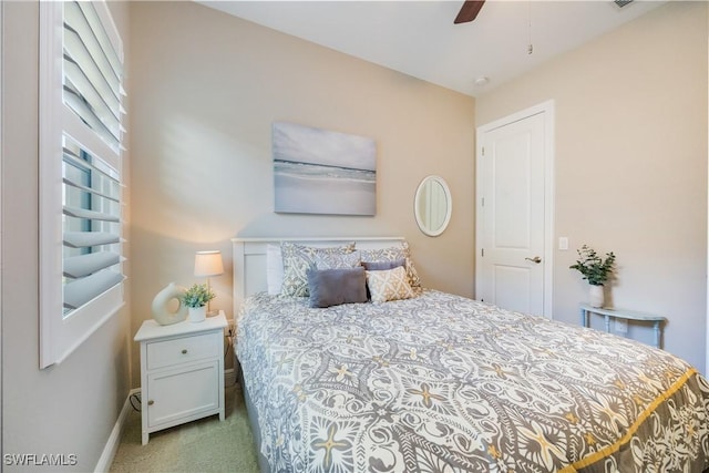 bedroom featuring ceiling fan and light colored carpet