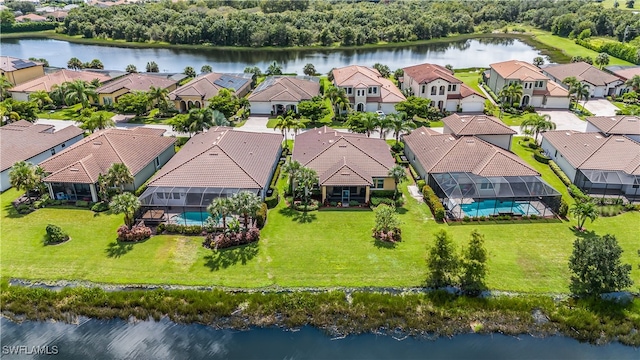 birds eye view of property featuring a water view