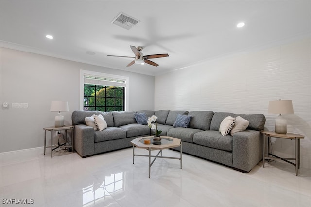 living room with ornamental molding and ceiling fan