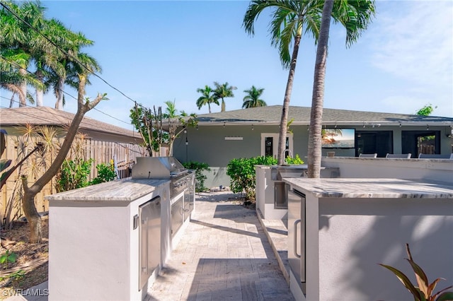 view of patio / terrace with exterior kitchen and area for grilling