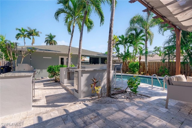 view of patio / terrace featuring a fenced in pool