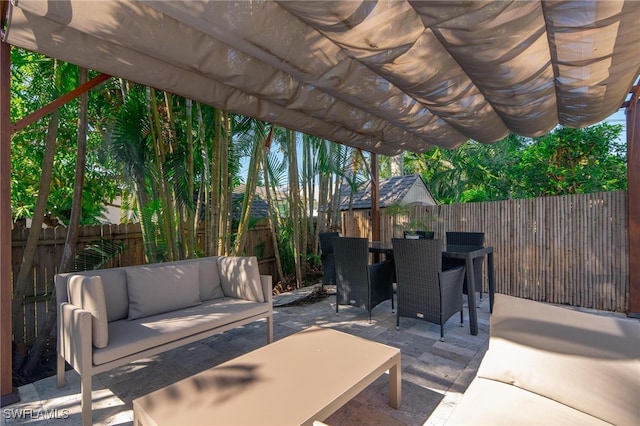 view of patio with outdoor lounge area and a pergola