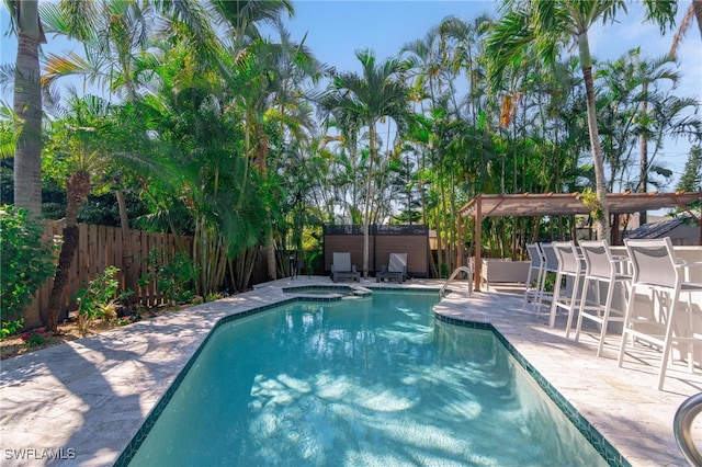 view of swimming pool with an in ground hot tub and a patio area