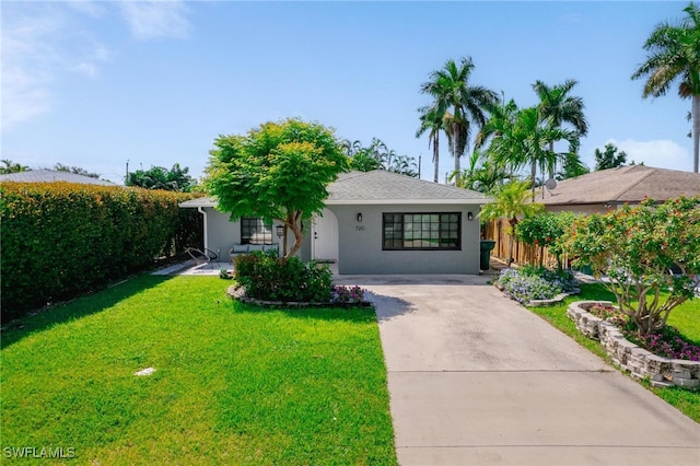 ranch-style house with a front lawn