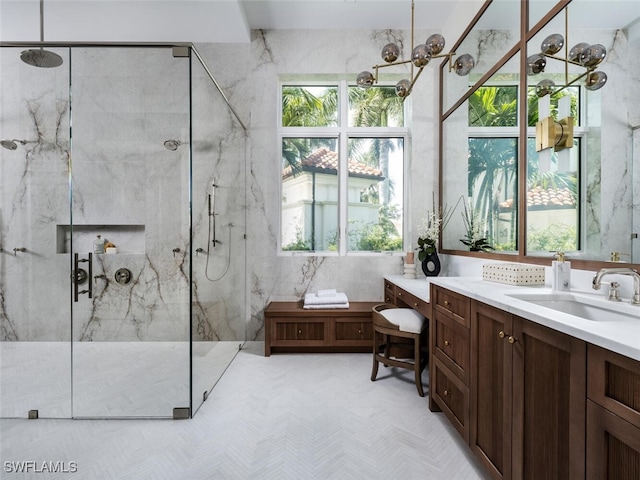 bathroom with walk in shower and vanity