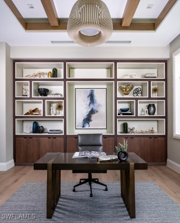 office featuring beam ceiling and light hardwood / wood-style floors