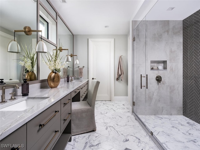 bathroom with a shower with door and vanity